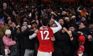 Arsenal FC v Manchester United - Premier League<br>LONDON, ENGLAND - JANUARY 22: William Saliba celebrates the 3rd goal with the Arsenal fans during the Premier League match between Arsenal FC and Manchester United at Emirates Stadium on January 22, 2023 in London, England. (Photo by Stuart MacFarlane/Arsenal FC via Getty Images)