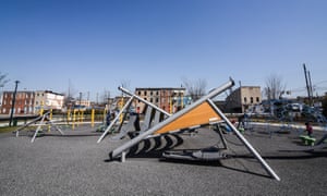 A row of abandoned homes border Eager Park’s playground, Baltimore, which was opened news in 2017