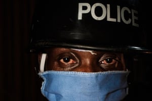 A police officer looks on as he patrols during a curfew in Kampala, in April 2020