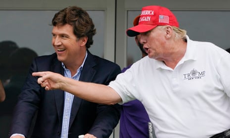Tucker Carlson,President Donald Trump<br>Tucker Carlson, left, and former President Donald Trump, talk while watching golfers on the 16th tee during the final round of the LIV Golf Invitational at Trump National in Bedminster, N.J., July 31, 2022. A defamation lawsuit against Fox News is revealing blunt behind-the-scenes opinions by its top figures about Donald Trump, including a Tucker Carlson text message where he said “I hate him passionately.” Carlson's private conversation was revealed in court papers at virtually the same time as the former president was hailing the Fox News host on social media for a “great job” for using U.S. Capitol security video to produce a false narrative of the Jan. 6, 2021, insurrection. (AP Photo/Seth Wenig, File)