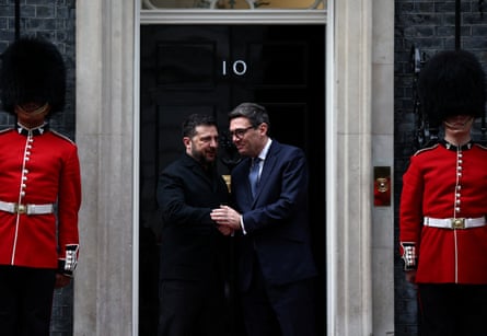 Andy Burnham and Ukraine’s President Volodymyr Zelenskyy chat on the steps of 10 Downing Street flanked by members of the Irish guards in central London.