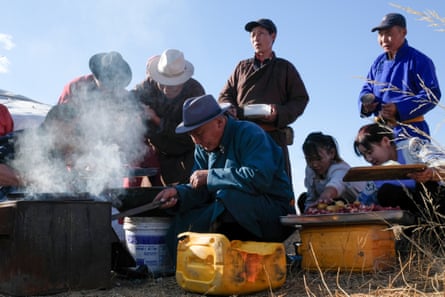 Herders prepare a traditional meal of boiled mutton.