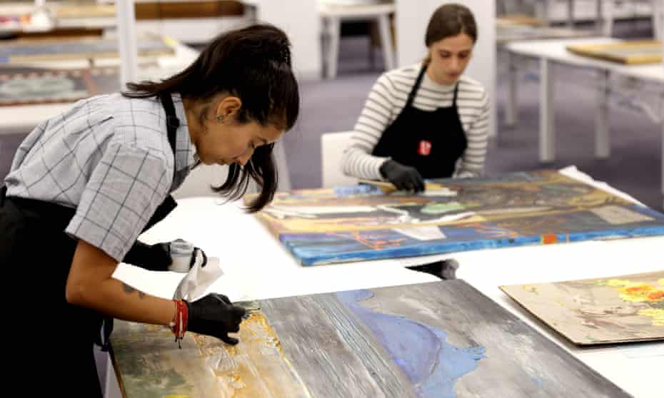 Conservators repair flood-damaged artworks from Lismore art gallery at a new creative hub at the registrar general’s building in Sydney’s CBD