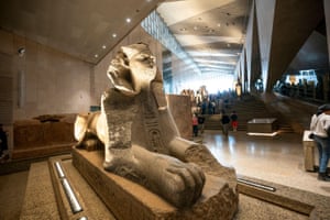 A statue of a sphinx in a museum hall