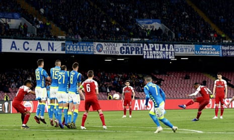 Alexandre Lacazette of Arsenal hits home a free-kick to ensure his side’s progress at the expense of Napoli.
