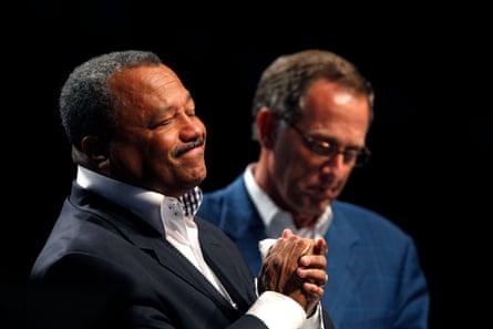 close-up of two men wearing suits standing next to each other