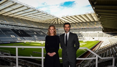 Amanda Staveley and Mehrdad Ghodoussi pose for photographs inside St James’ Park after meeting with staff on Friday.