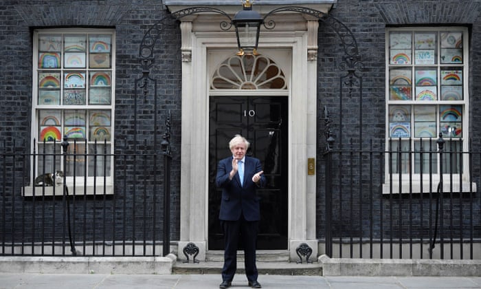 Boris Johnson applauds outside 10 Downing Street during the Clap for our Carers campaign in London