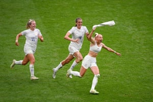 Chloe Kelly of England celebrates scoring the winning goal against Germany with teammates Lauren Hemp and Jill Scott during the Women’s Euro 2022 final at Wembley