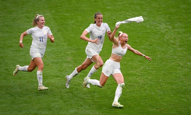 England footballer Chloe Kelly waves her shirt over her head