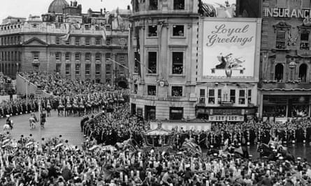 The late queen passing through Trafalgar Square in her carriage on her way to her coronation.