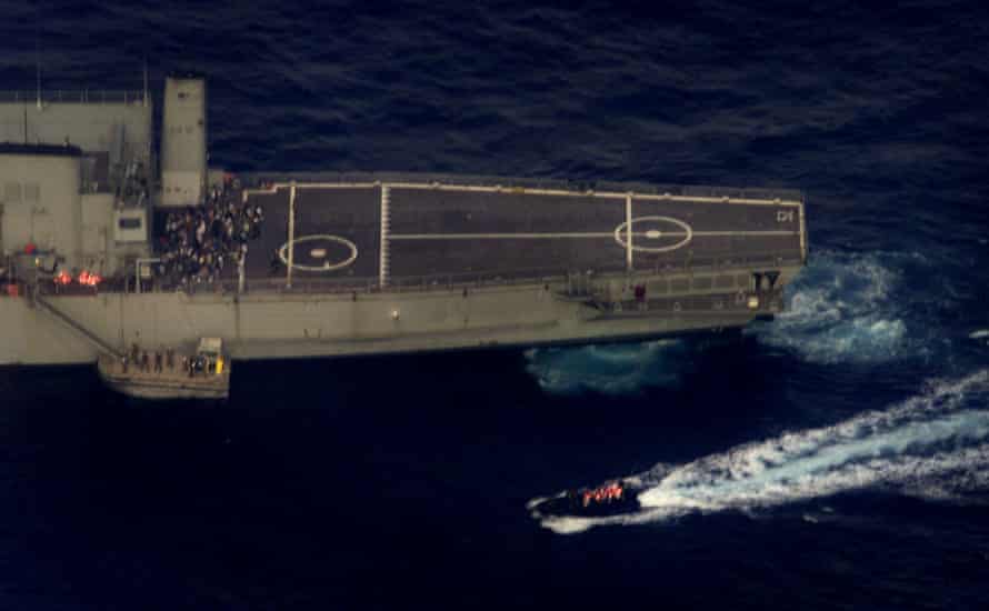 Special forces troops transfer asylum seekers from the Norwegian freighter MV Tampa in September 2001