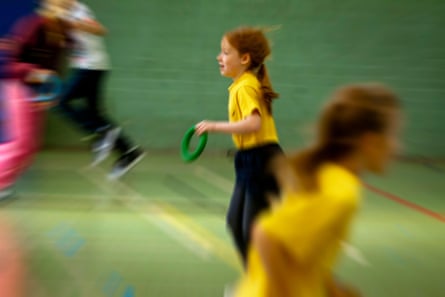 Pupils taking part in indoor sport at a primary school