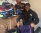 Malaika Meena sorting out the donated kit.