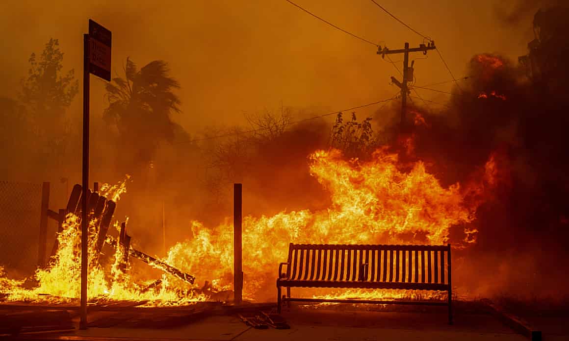 The Eaton fire burns a bus stop in Altadena, California, on Wednesday.