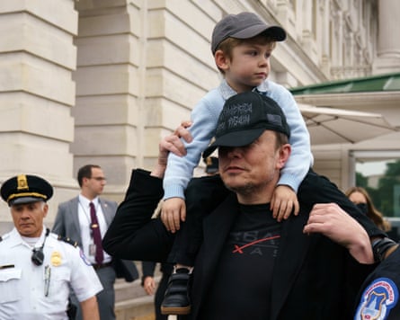 a man carries a boy on his shoulders