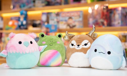 Four Squishmallow toys on a shop counter