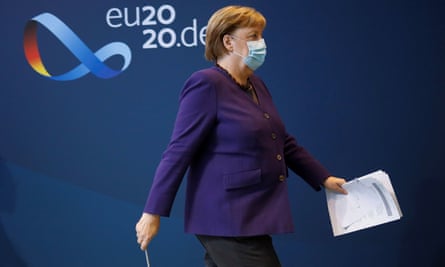 Angela Merkel leaving a news conference in Berlin