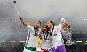 And a selfie stick. Sergio Ramos, Luka Modric and Gareth Bale smile for the camera.