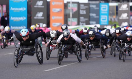 Daniel Romanchuk (left) and David Weir (centre) early on in the elite men’s wheelchair race at the London Marathon