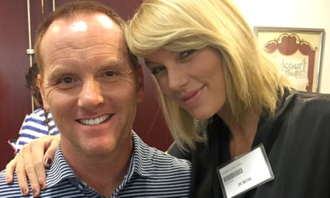 Taylor Swift poses for a photo with Bryan Merville, another potential juror, in a courthouse waiting area in Nashville.