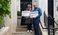 Margaret Hodge and Labour candidate Joe Powell on the steps of a grand, black-doored property's steps holding up placards saying 'Kensington Against Dirty Money'