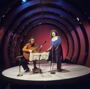 Australian classical guitarist John Williams performs with English singer Cleo Laine on a television show at BBC Television Centre in London in November 1977