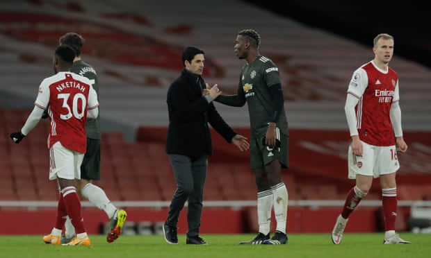 Arsenal manager Mikel Arteta shakes hands with Manchester United’s Paul Pogba at full-time.