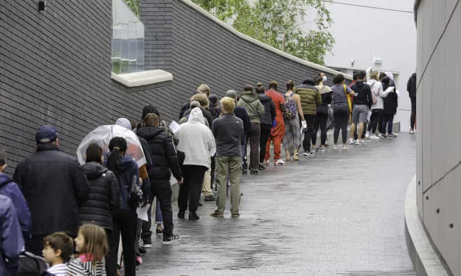People queuing for the first dose of Pfizer Covid-19 vaccine being offered to adults over the age of 18 at Tottenham Hotspur Stadium.