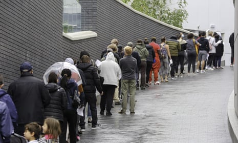 A queue for the first dose of the Pfizer vaccine outside Tottenham Hotspur stadium in London.