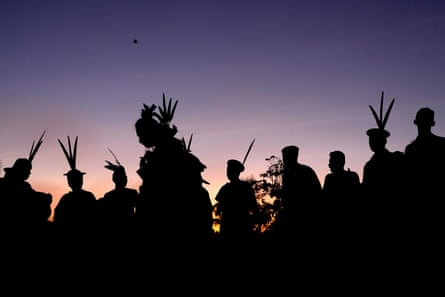 Asháninka Indigenous people dancing at dawn.