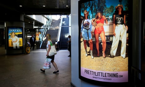 A billboard advertising the Boohoo brand Pretty Little Thing