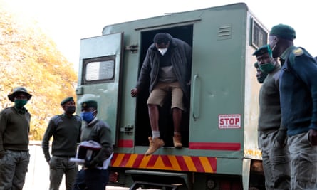 Hopwell Chin’ono gets out of a prison van as he arrives at Harare magistrates courts on Thursday.