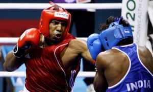 Tariq Abdul Haqq of Trinidad and Tobago (red) competes at the Delhi 2010 Commonwealth Games. He later died fighting for Isis in their self-declared ‘caliphate’ in Iraq and Syria.