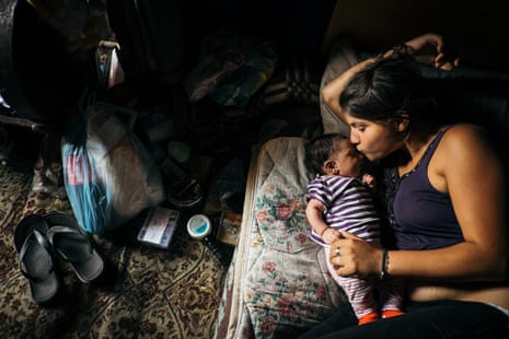 Fljurija Katunari, 18, with her two month-old daughter, Elvira, in a shack on the outskirts of Belgrade, Serbia.