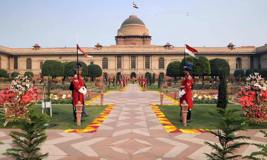 Guards stand in the Mughal gardens of the Indian Presidential Palace.