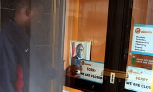 A money transfer agency remains closed in Harare, Zimbabwe