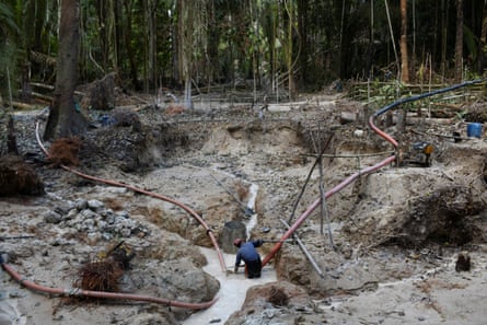 A miner works in an illegal goldmine in Itaituba, Pará state, Brazil, September 2021.