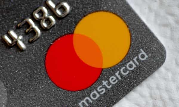 A Mastercard logo is seen on a credit card