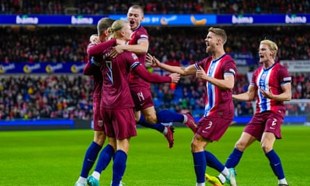 Erling Haaland celebrates with his teammates after scoring in Norway’s 3-0 win over Slovenia.