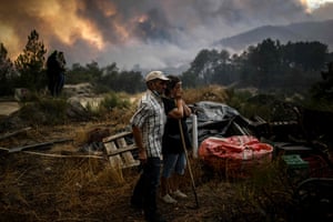 Orjais, Portugal. Locals watch the advance of a wildfire