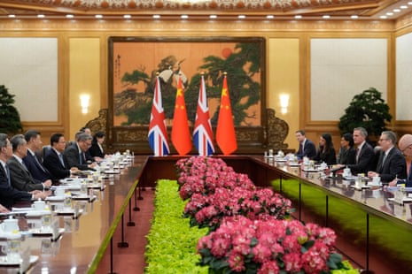 A view of the meeting between Chinese leader Xi Jinping, third left, and Britain's prime minister Keir Starmer, second right