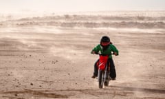 Zara and Tully Burke ride dirt bikes on the Birdsville common