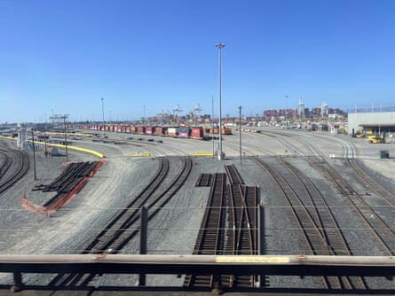 A shipping port with train tracks running through it