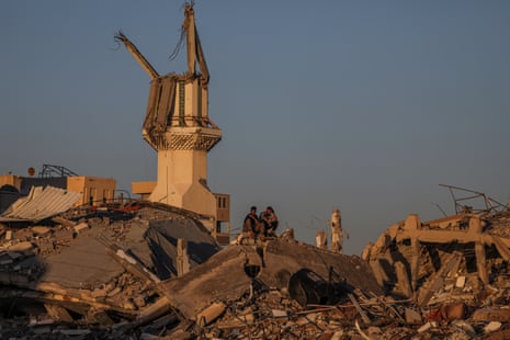Israel-Gaza war live: ‘mid-level’ Israeli team heads to Cairo to assess Hamas ceasefire position Palestinians sit among the rubble of a destroyed house along Salah Al Din road between Rafah and Khan Younis.