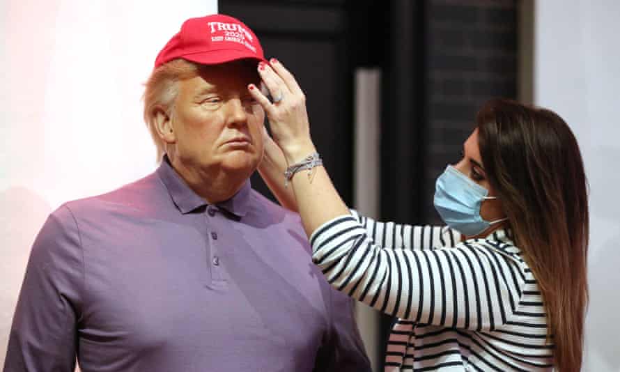 A member of the Madame Tussauds studio team adjusts a wax figure of Donald Trump in London on 4 November 2020.