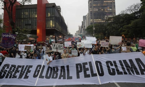Demonstrators hold a “Global strike for climate” banner during a protest on climate change in São Paulo, Brazil.