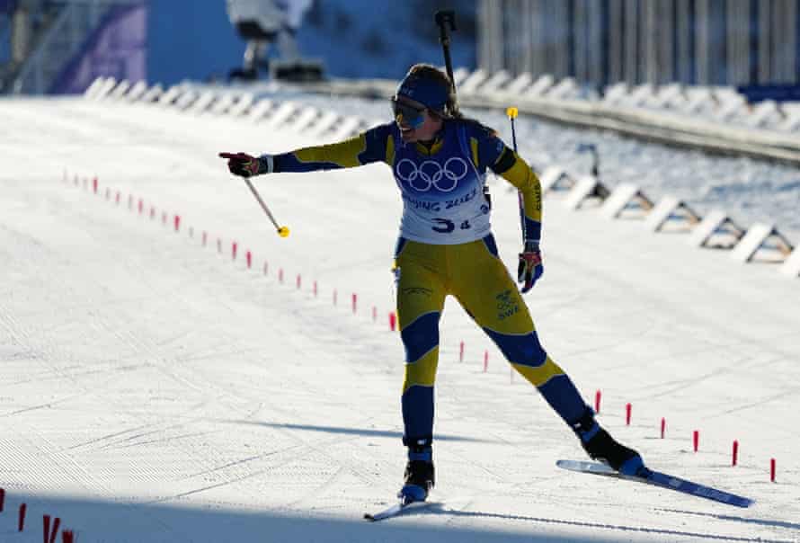Elvira Oeberg of Sweden celebrates as she approaches the finish line.