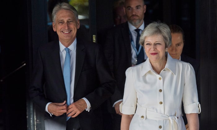 Theresa May arrives at the conference with Philip Hammond.