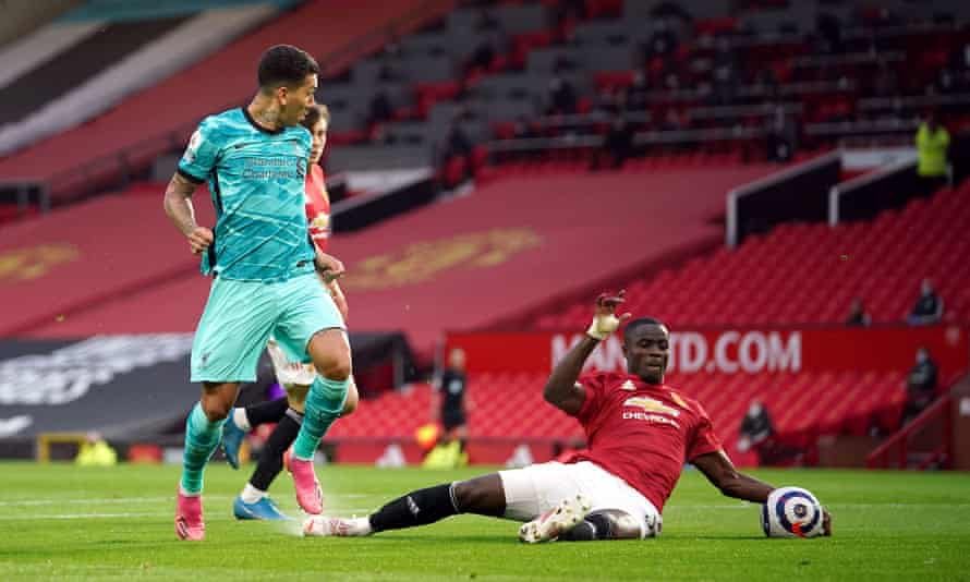 Eric Bailly makes a tackle on Roberto Firmino during Manchester United's defeat to Liverpool.